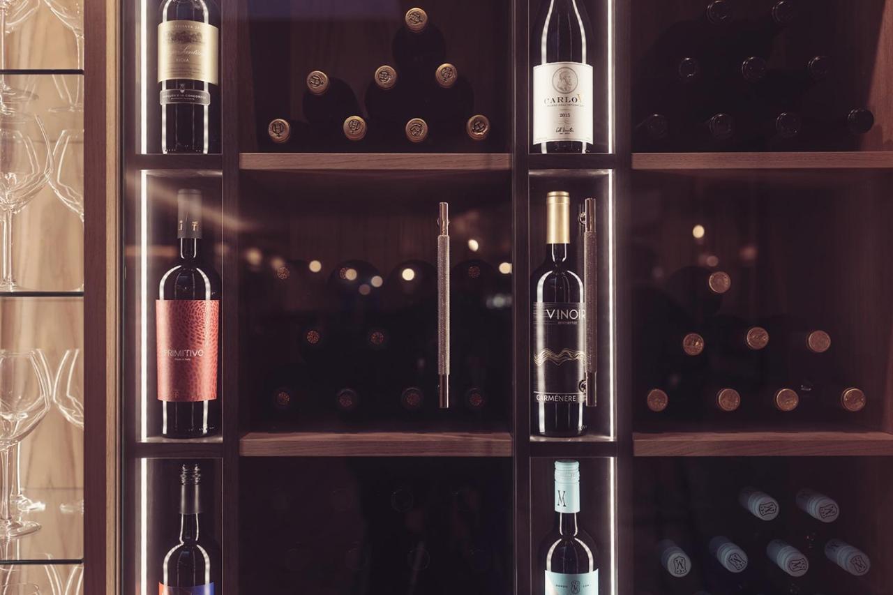 Longlands Inn & Cottages Carnforth Esterno foto Wine bottles in a wine rack