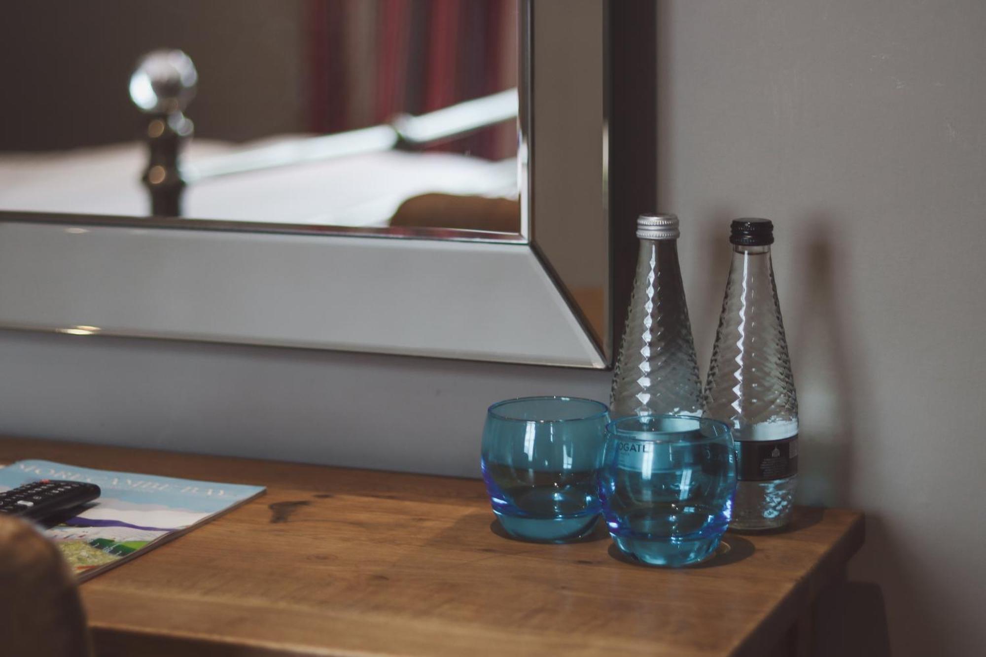 Longlands Inn & Cottages Carnforth Esterno foto Bottled water in a hotel room